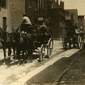 BALTIMORE: CARRIAGES, 1910. Horse-drawn carriages in Fells Point, Baltimore, Maryland