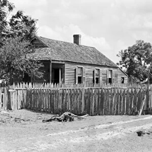 BAYOU: COTTAGE, 1938. A rustic cottage at the Bayou La Fourche, Louisiana