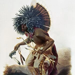 BODMER: MINATARRI MAN. Minatarri man in costume of the Dog Dance. Aquatint, 1844