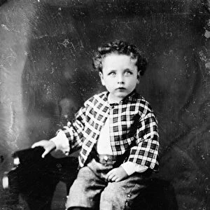BOY, 19th CENTURY. A young boy wearing a checkered jacket. Photograph of a daguerreotype