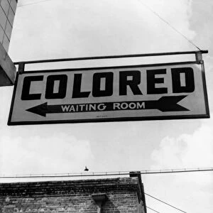 BUS STATION, 1943. The sign for the colored waiting room at a bus station in Rome, Georgia