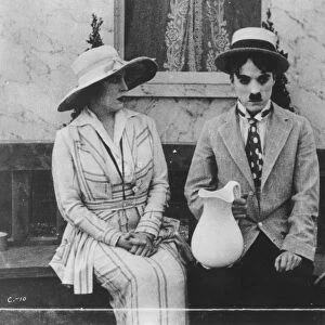 CHAPLIN: THE CURE (1917). Charlie Chaplin and Edna Purviance in The Cure