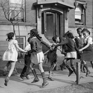 CHICAGO: CHILDREN, 1941. Children playing ring around the rosie in the Black Belt