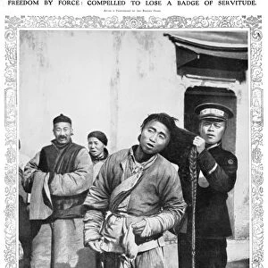 CHINA: REVOLUTION, 1912. A revolutionary soldier cuts the hair of a man, unwilling to give up his pigtail during the Xinhai Revolution. Photograph from an English newspaper of 1912