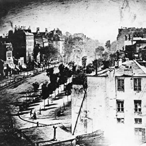 Daguerreotype made in 1838 by Louis-Jacques-Mande Daguerre of a Paris boulevard, the first photograph to show a human being