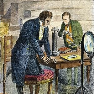 HANS CHRISTIAN OERSTED. Oersteds discovery in 1819 that a pivoted magnetic needle turns at right angles to a conductor carrying an electric current: colored engraving, 19th century