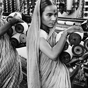 INDIA: TEXTILE MILL, c1942. Employees at a busy textile mill in Bombay, India. Photograph