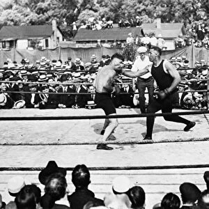 JACK DEMPSEY (1895-1983). American boxer. Dempsey sparring with a partner, c1919
