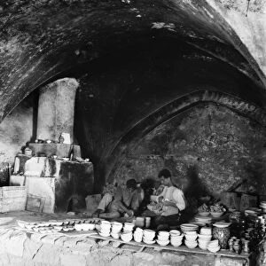 JERUSALEM: FAIENCE KILN. Faience potters in Jerusalem prepare pots to be fired in the kiln