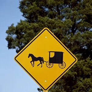 LANCASTER COUNTY, c1999. Road sign indicating the presence of Amish horse-drawn