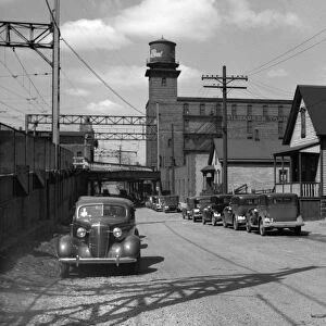 MILWAUKEE: STREET, 1936. Working class houses on Detroit and Van Buren Streets
