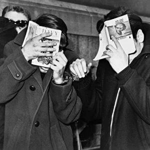 NEW YORK: ARREST, 1968. Two college students covering their faces at the police station