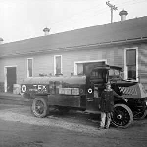 OIL DELIVERY TRUCK, c1920. Texaco oil delivery truck and driver. Photograph, c1920
