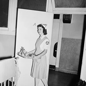 RED CROSS, c1942. A Red Cross nurses aid working in an American hospital as part