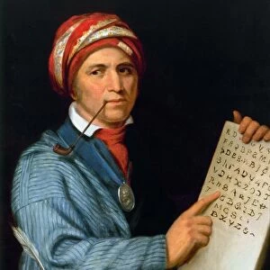 SEQUOYA (1770?-1843). Native American scholar, with his printed Cherokee alphabet
