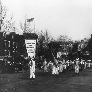 SUFFRAGE PARADE, 1913. Women holding banners with the names of foreign countries