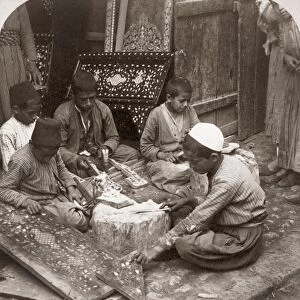 SYRIA: CRAFTSMEN, c1900. Boys making crafts with inlaid pearl work in Damascus, Syria