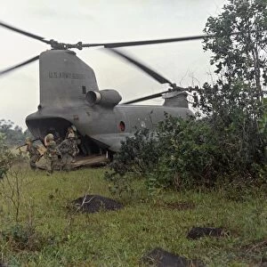 VIETNAM WAR, 1967. Troops from the 4th Infantry unloading from a CH-47A Chinook