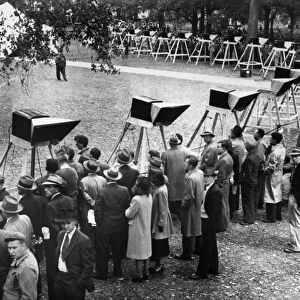 WORLD SERIES, 1948. People gathered around some of the 100 television sets installed on Boston Common to watch a broadcast of Game 1 of the 1948 World Series between the Boston Braves and the Cleveland Indians, 6 October 1948