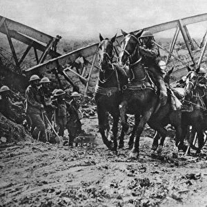 WORLD WAR I: ARTILLERY. British field artillery crossing a dry canal bed because
