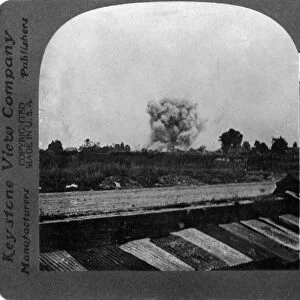 WORLD WAR I: EXPLOSION. A shell exploding during World War I. Stereograph, c1916