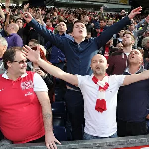 Arsenal Fans Celebrate Victory over West Bromwich Albion in Premier League Match