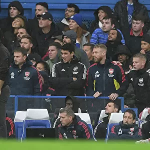 Arsenal Manager Mikel Arteta Conferring with Assistant Coach Albert Stuivenberg during Chelsea vs Arsenal, Premier League 2022-23