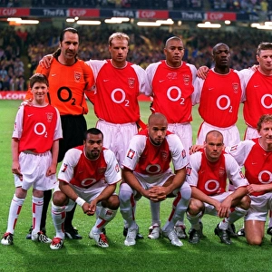 The Arsenal team with mascot Jude Smith before the match