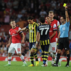 Arsenal v Fenerbahce: Wilshere Fouls Gonul - UEFA Champions League Play-offs Clash