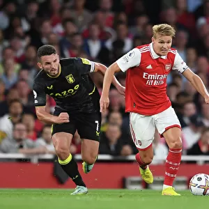 Arsenal vs Aston Villa: Martin Odegaard Clashes with John McGinn in Premier League Showdown (2022-23)