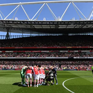 Arsenal vs Leeds United: Premier League Showdown - Arsenal Team Huddle at Emirates Stadium