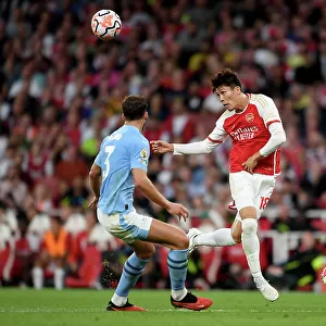 Arsenal vs Manchester City: Tomiyasu Fends Off Walker in Intense Premier League Clash (2023-24)