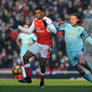 Arsenal's Alex Iwobi Outmaneuvers Burnley's Jeff Hendrick in Premier League Clash