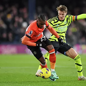 Arsenal's Martin Odegaard Faces Off Against Luton Town's Amari Bell in Premier League Clash (Luton Town vs Arsenal 2023-24)