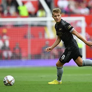 Arsenal's Martin Odegaard Goes Head-to-Head with Manchester United in Premier League Clash (2022-23)