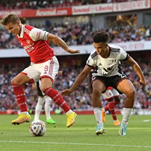 Arsenal's Odegaard Faces Off Against Fulham's Robinson in Premier League Clash