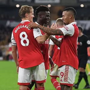 Arsenal's Odegaard and Saka: Celebrating Goals in Style against Wolverhampton Wanderers (2022-23)