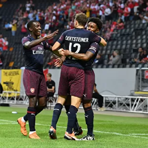 Arsenal's Reiss Nelson, Eddie Nketiah, and Stephan Lichtsteiner Celebrate Goal Against SS Lazio in 2018 Pre-Season Friendly