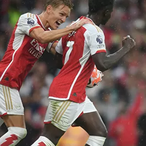 Arsenal's Saka and Odegaard Celebrate First Goal vs. Fulham in 2023-24 Premier League