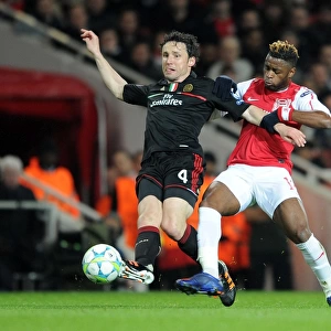 Arsenal's Triumph: 3-0 Over AC Milan - The Unforgettable Clash Between Alex Song and Mark van Bommel in the UEFA Champions League