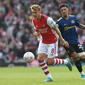 Clash of Talents: Arsenal's Odegaard vs. Man Utd's Sancho in the Premier League Showdown