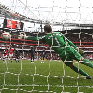 Emmanuel Eboue shoots past Paul Robinson from the penalty