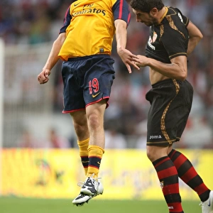 Jack Wilshere (Arsenal) Ivica Dragutinovic (Seville)