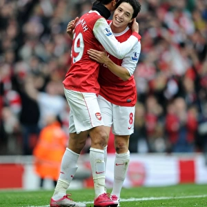 Marouane Chamakh celebrates scoring Arsenals 2nd goal with Samir Nasri