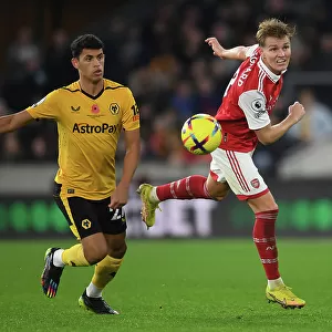 Martin Odegaard vs. Matheus Nunes: Heading Battle at Molineux - Wolverhampton Wanderers vs. Arsenal FC, Premier League 2022-23
