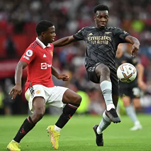 Nketiah vs Malacia: A Premier League Showdown at Old Trafford (2022-23)
