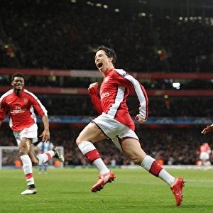 Samir Nasri celebrates scoring the 3rd Arsenal goal with Nicklas Bendtner