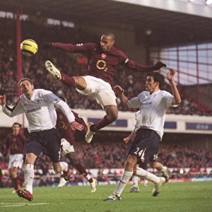 Thierry Henry (Arsenal) Nicky Hunt and Joey O Brien (Bolton)