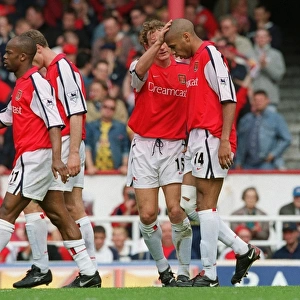 Thierry Henry is congratulated by Ray Parlour on scoring his 2nd Arsenal goal