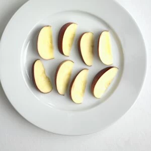 Apple slices on white plate
